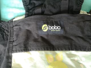 Mochila porta bebés de tela. 