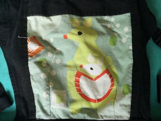 Mochila porta bebés de tela. 