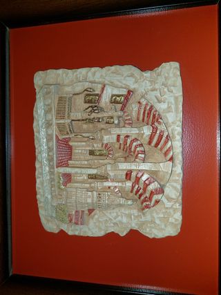 Dos cuadros de madera y piedra.