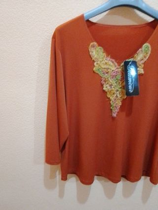 Camiseta naranja de mujer con manga semi