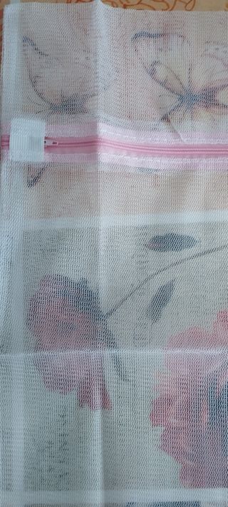 Bolsa de lavandería de malla blanca nueva
