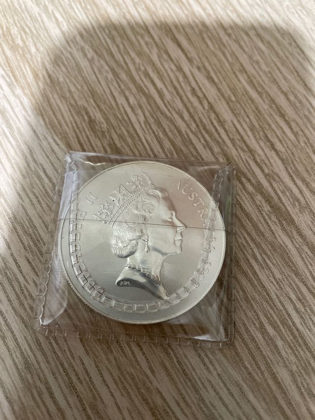 Monedas plata Elizabeth II y One dolar australia
