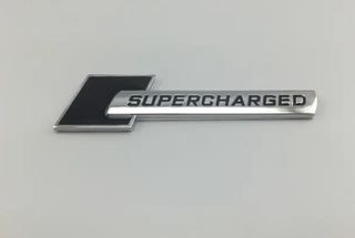 EMBLEMA SUPERCHARGED AUDI NEGRO