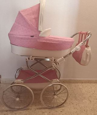Carrito reborn color rosa y blanco