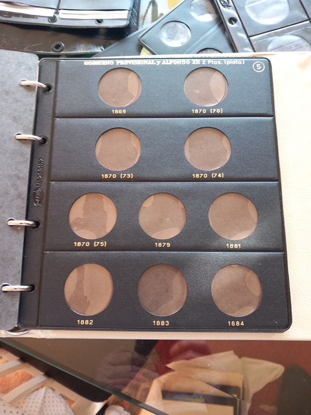 álbum de moneda y hojas