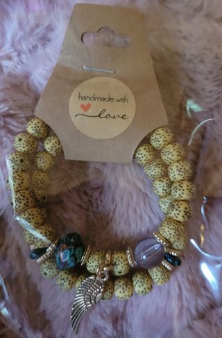 Pulsera ala plateada y bolas amarillas