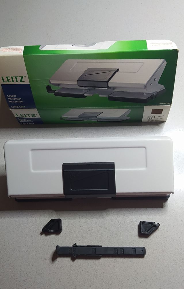 Perforador papel cuatro agujeros