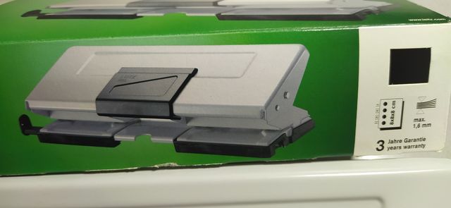 Perforador papel cuatro agujeros