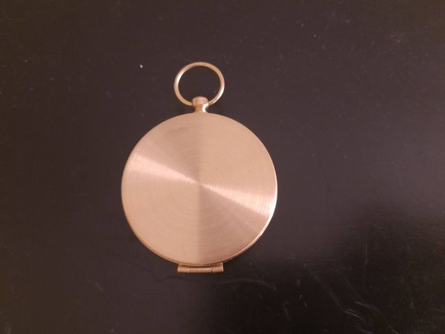 Brújula dorada reflectante con tapa nueva