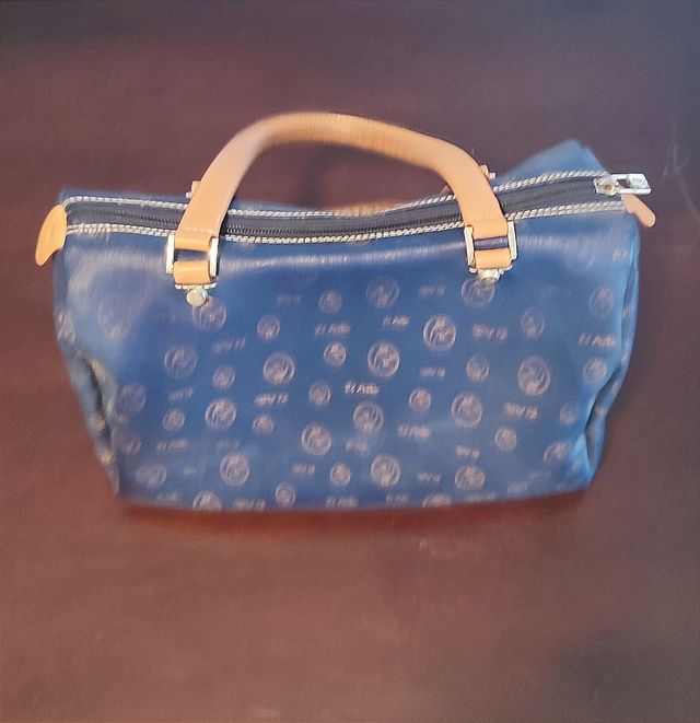 Bolso de mano de lona y piel de vacuno de El Potro