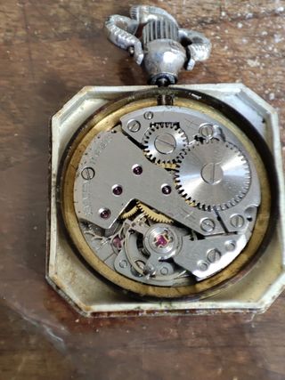 Orologio a ciondolo in argento e oro e smalti