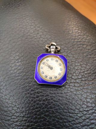 Orologio a ciondolo in argento e oro e smalti