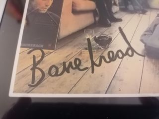 reproducción cartel Oasis firmado