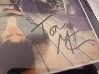 reproducción cartel Oasis firmado