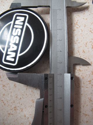 JUEGO DE 4 TAPAS DE LLANTAS NISSAN