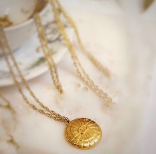 collar chanel gigi paris chapado en oro 