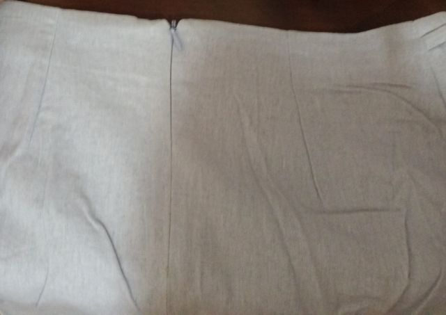 Falda corta  tablitas, muy mona.