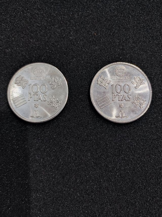dos monedas de 100 pesetas