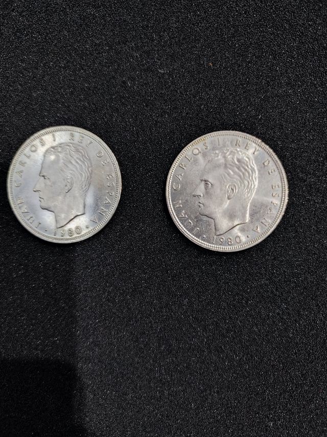dos monedas de 100 pesetas