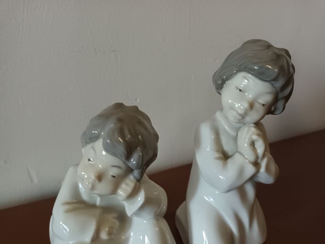 Pareja de figuras GDR porcelana.