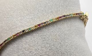 Pulsera riviere de 18 kt con zafiros, rubíes...