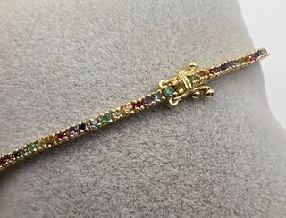 Pulsera riviere de 18 kt con zafiros, rubíes...