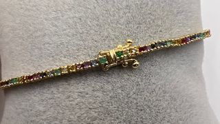 Pulsera riviere de 18 kt con zafiros, rubíes...