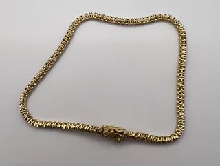 Pulsera riviere de 18 kt con zafiros, rubíes...