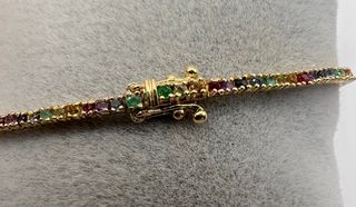 Pulsera riviere de 18 kt con zafiros, rubíes...