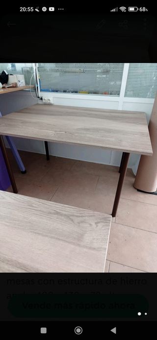 mesas de hierro y parte de arriba de madera