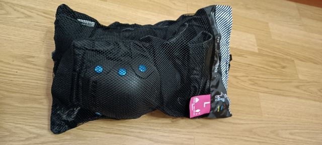 patines con  protecciones y bolsa de transporte
