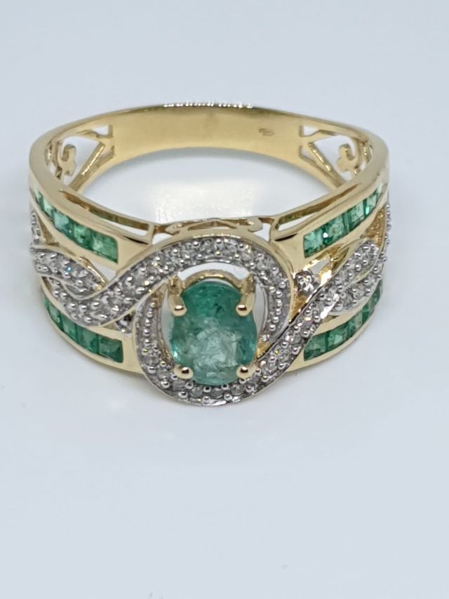 Anillo oro diamantes y esmeradas