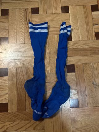 Botas de fútbol con tacos y traje de portero