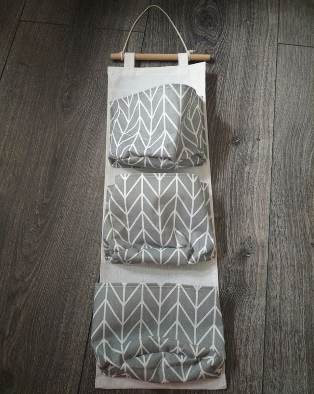 Appendino grigio con tasche