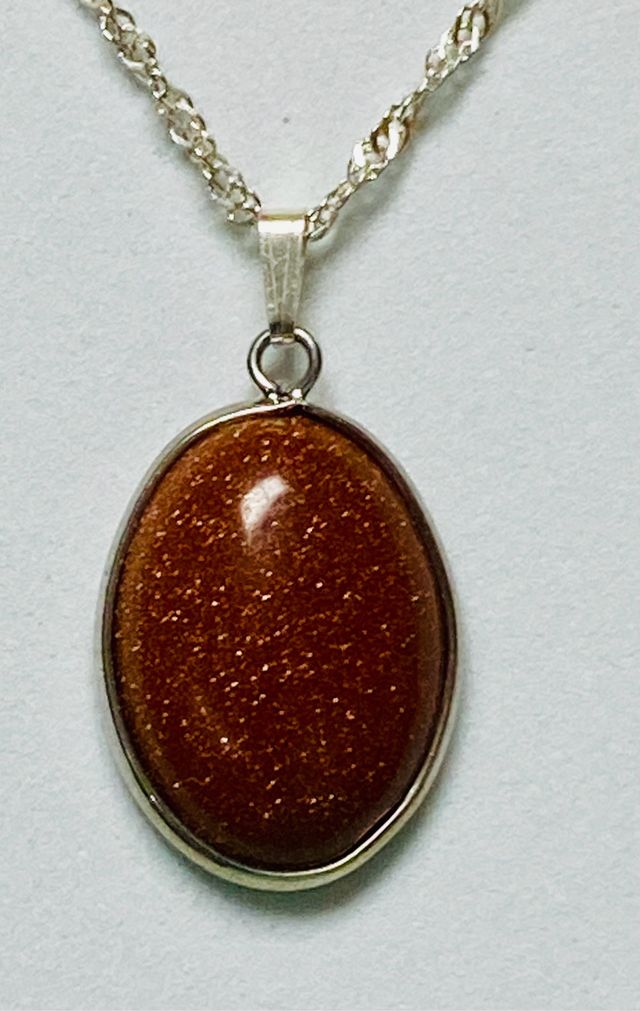 Colgante con aventurina oro y cadena plata ley 925