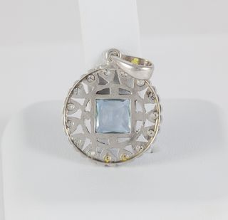 Colgante en oro blanco 18k con brillantes y zafiro