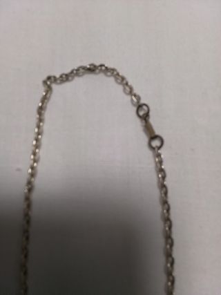 Medalla con su cadena en buen estado