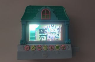 Casita de muñeca electrónica 