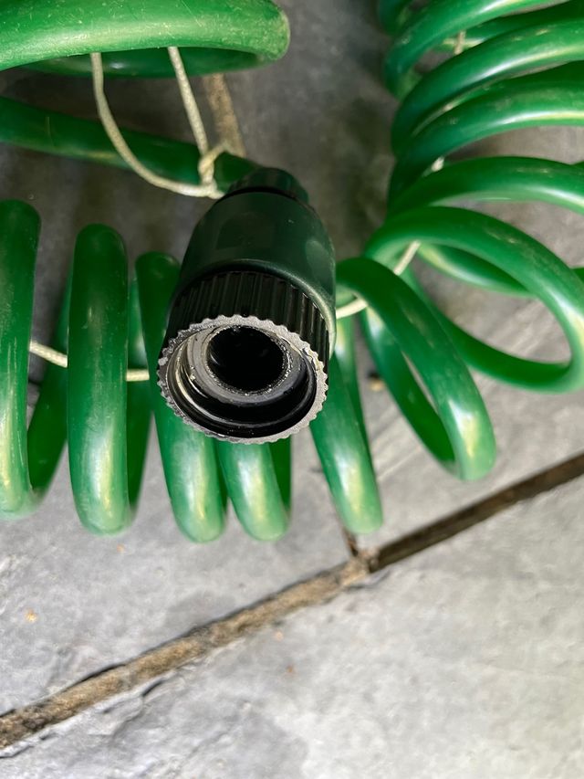 Manguera espiral jardín 15 metros con pistola