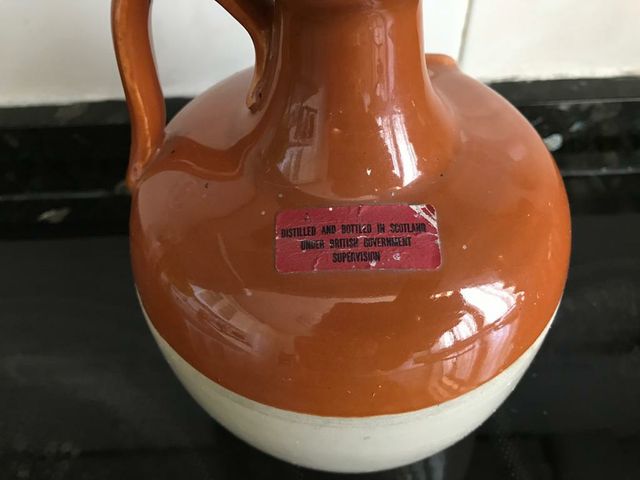 Botella vacía de whisky Munro's King of Kings