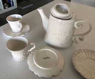 Teiera con 6 tazzine e piattini