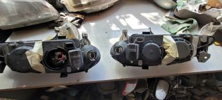 Juego faros renault megane 1996