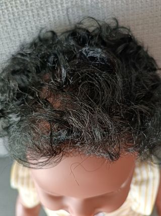 Bebé Reborn Afroamericano rizos y ojos verdes