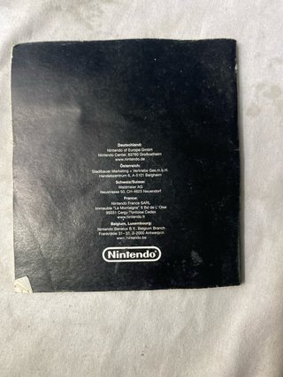 Consola Nintendo DS lite cargador y un juego