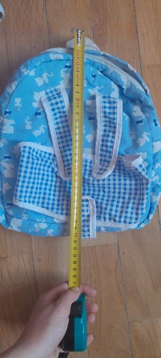 Mochila portabebes juguete