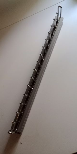 Percha corredera plegable