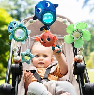 juguete para cochecito con clip universal