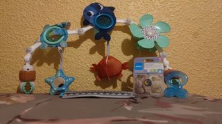 juguete para cochecito con clip universal