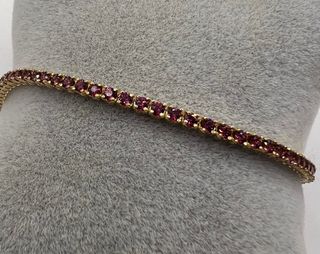 Pulsera riviere de oro de 18 kt con rodolitos 