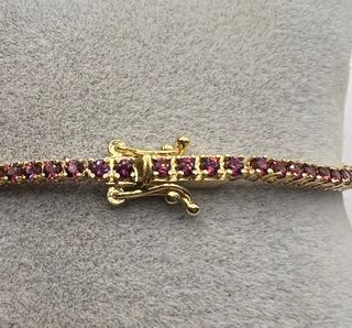 Pulsera riviere de oro de 18 kt con rodolitos 